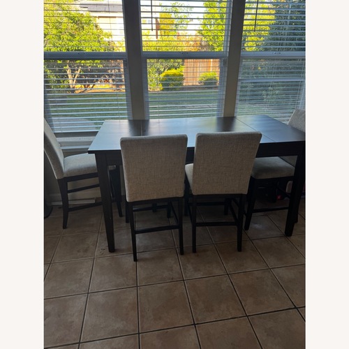 Used Dark Brown Wood Dining Set for sale on AptDeco