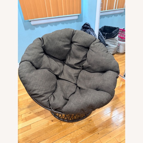 Used Dark Brown Papasan Swivel Chair for sale on AptDeco