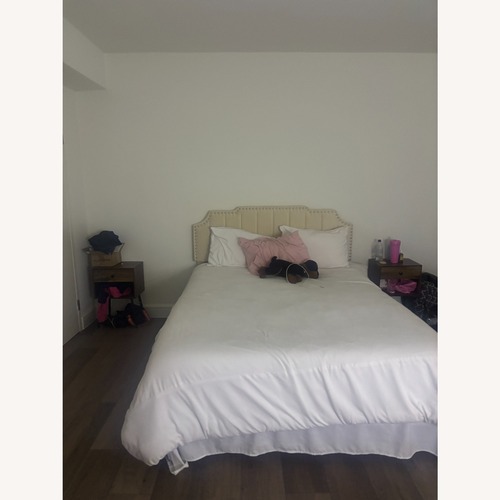 Used Queen Size Beige Upholstered Bed Frame for sale on AptDeco