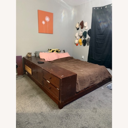 Used Dark Brown Wood Queen Bed for sale on AptDeco
