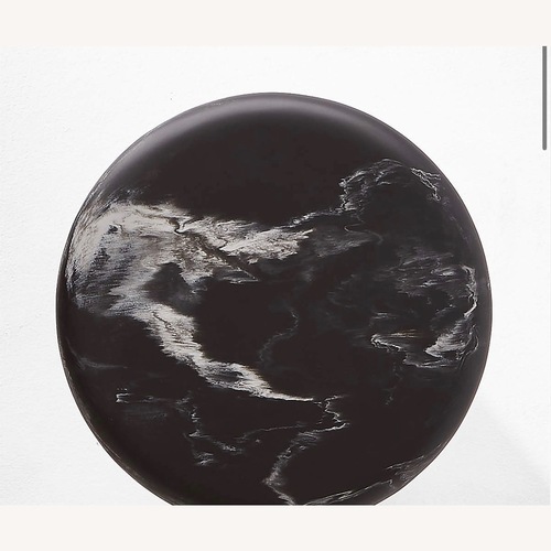 Used CB2 Espira Round Black Marbled Resin Side Table for sale on AptDeco