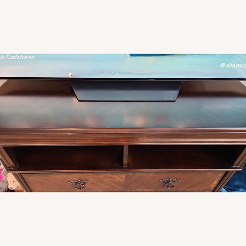 Used Dark Brown Wood Dresser / TV Rack for sale on AptDeco