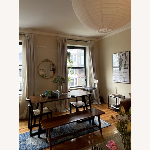 Used Dark Brown Wood Dining Table for sale on AptDeco