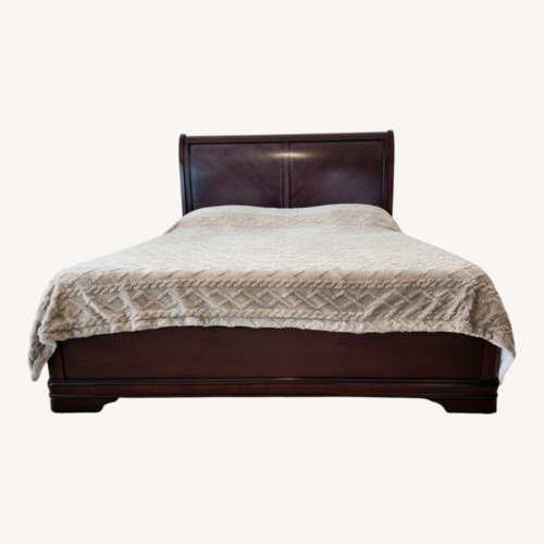 Used Ashley Furniture Dark Brown Wood King Sleigh Bed for sale on AptDeco