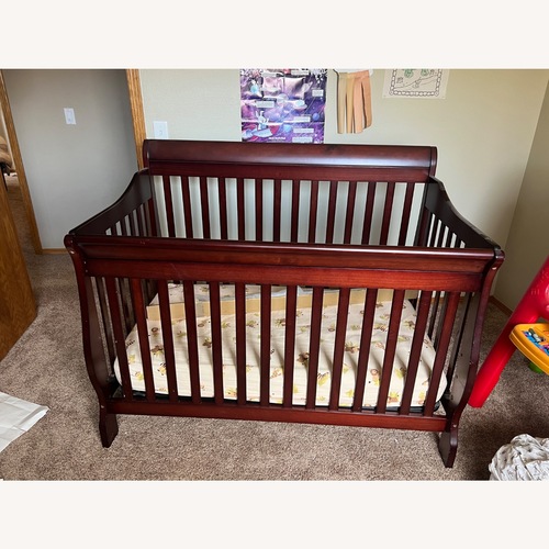 Used Delta Children Dark Brown Wood Crib for sale on AptDeco