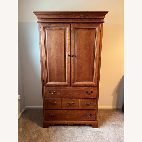 Used American Signature Furniture Wood Armoire for sale on AptDeco
