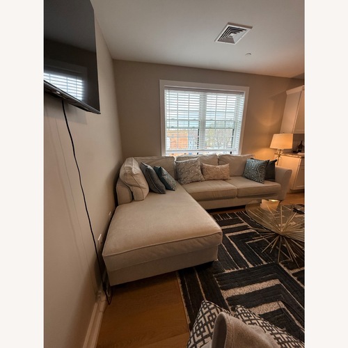 Used Jordan’s Light Beige Sectional Sofa with Chaise for sale on AptDeco