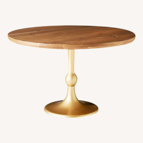 Used Anthropologie Tulipa Natural Wood Dining Table for sale on AptDeco