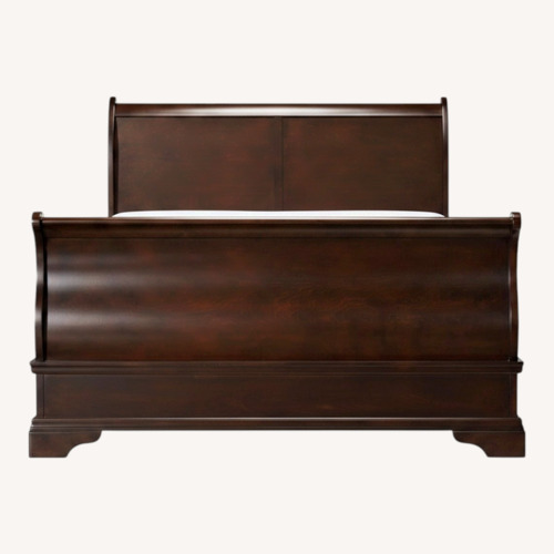 Used Raymour & Flanigan Dark Brown Wood Full Bed for sale on AptDeco