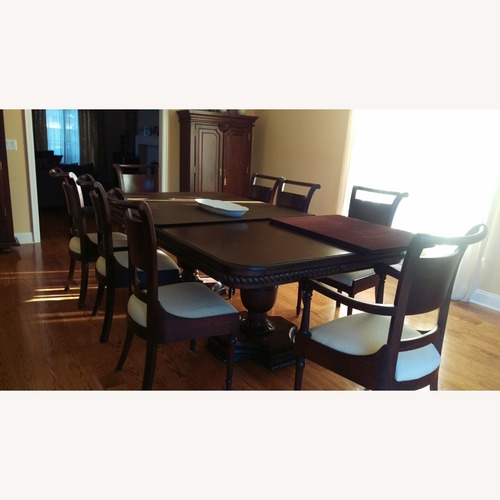 Used Dark Brown Solid Dining Table for sale on AptDeco