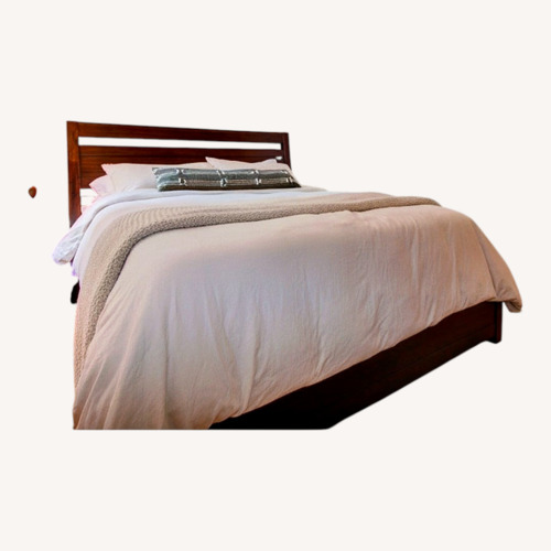 Used Ashley Furniture King Wood Bed Frame for sale on AptDeco