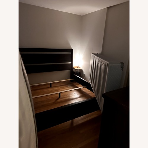 Used Ashley Furniture King Wood Bed Frame for sale on AptDeco