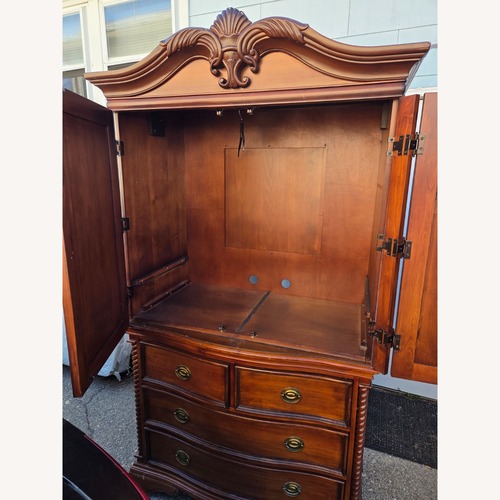 Used Dark Brown Wood Armoire  for sale on AptDeco
