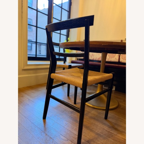 Used Anthropologie Black Wood Dining Chairs for sale on AptDeco