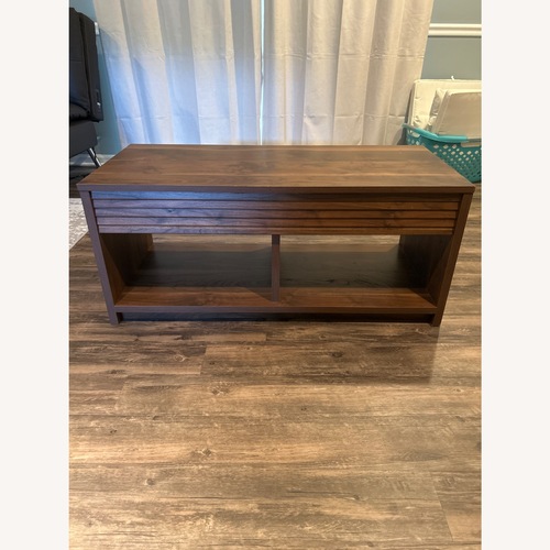 Used World Market Natural Wood Veneer Coffee Table for sale on AptDeco