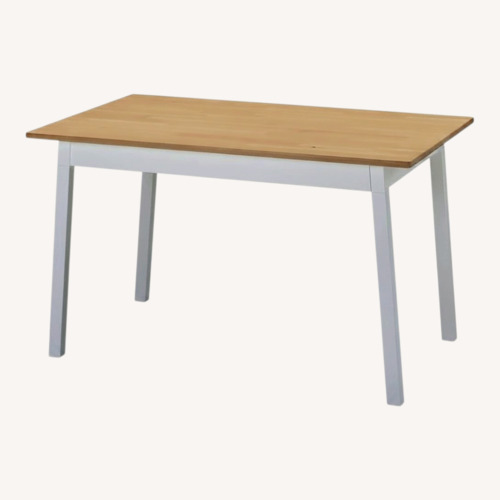 Used IKEA Pinntorp Natural Wood Dining Table for sale on AptDeco