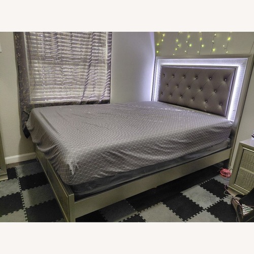 Used Ashley Furniture Dark Gray Wood Queen Bed for sale on AptDeco
