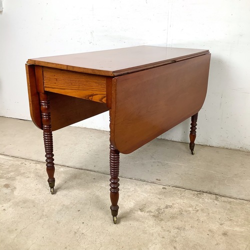 Used Antique Drop-Leaf Table, Spool Legs, Brass Casters for sale on AptDeco