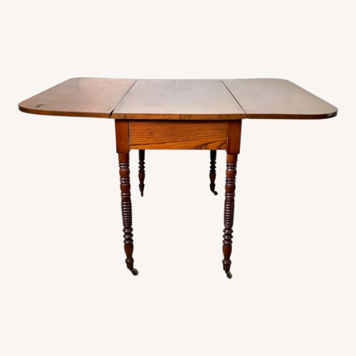 Used Antique Drop-Leaf Table, Spool Legs, Brass Casters for sale on AptDeco