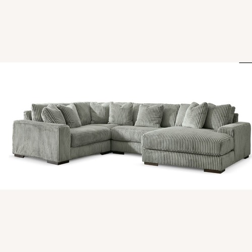 Used Ashley Furniture Gray 3+ Piece Sectional/Ottoman for sale on AptDeco