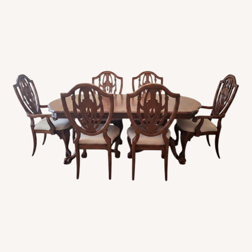 Used Vintage Wood Dining Set W 2 Extensions. Sits 6-12  for sale on AptDeco