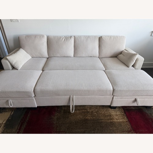 Used  Beige Modular Sectional with Pull‑Out Bed for sale on AptDeco
