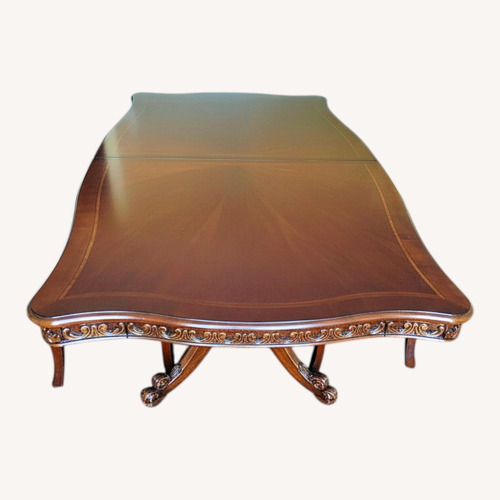 Used Rooms To Go Dark Brown Wood Dining Table for sale on AptDeco