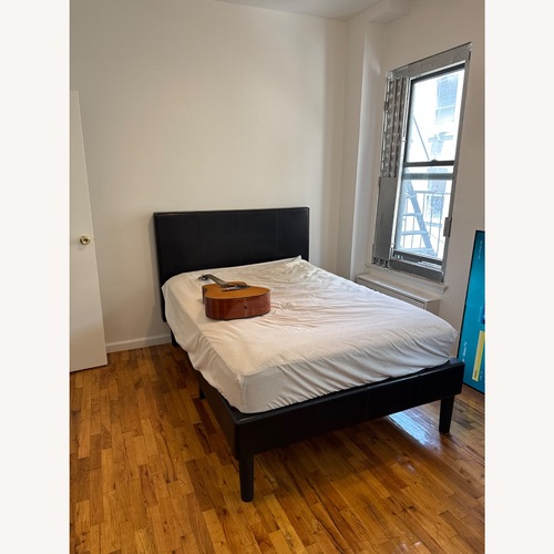 Used Black Leather Full Bed for sale on AptDeco