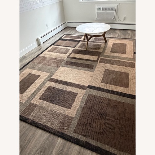 Used Dark Brown Fabric Area Rug 10' x 14' for sale on AptDeco