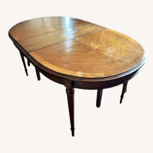 Used Dark Brown Wood Dining Table for sale on AptDeco