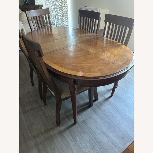 Used Dark Brown Wood Dining Table for sale on AptDeco