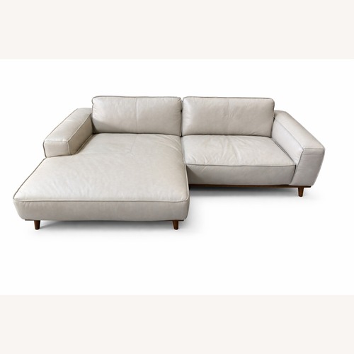 Used Beige Leather Sectional Sofa for sale on AptDeco