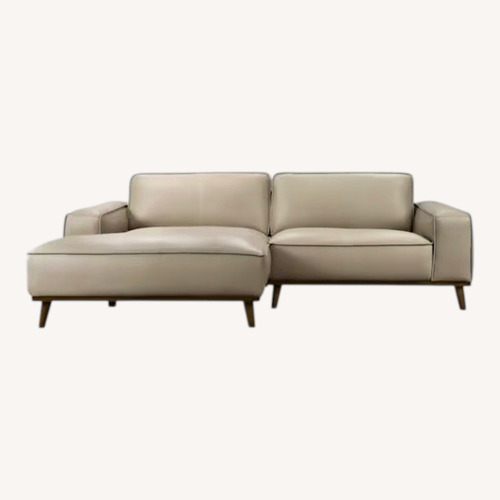 Used Beige Leather Sectional Sofa for sale on AptDeco