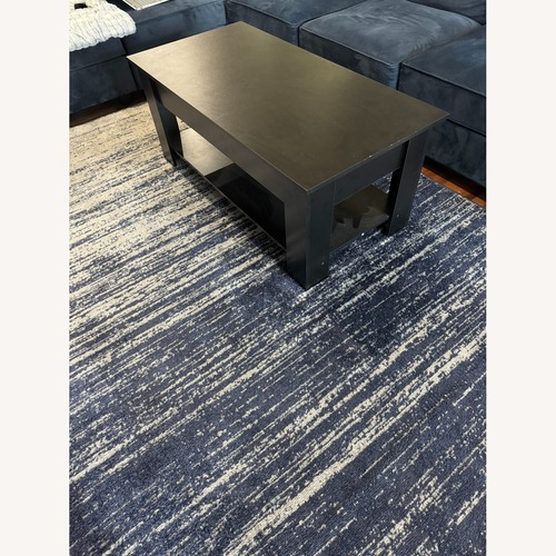 Used Black Wood Coffee Table for sale on AptDeco