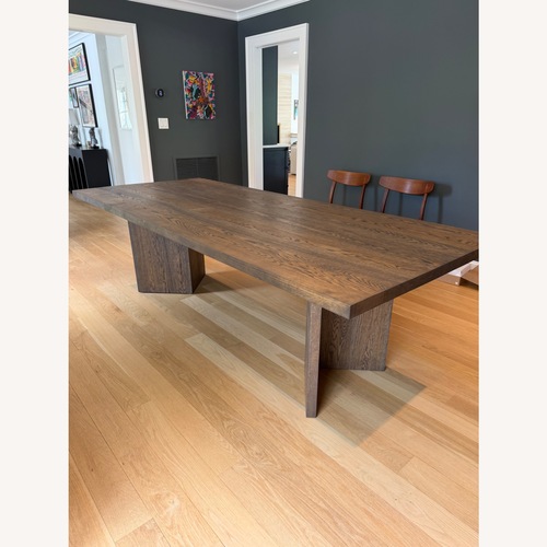 Used Dark Brown Oak Wood Dining Table for sale on AptDeco