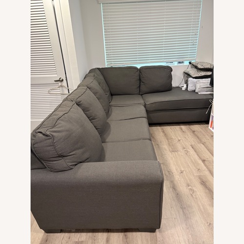 Used Living Spaces Dark Gray Fabric 2 Piece Sectional for sale on AptDeco