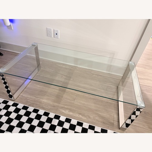 Used Contemporary Glass Coffee Table with Chrome Finish for sale on AptDeco