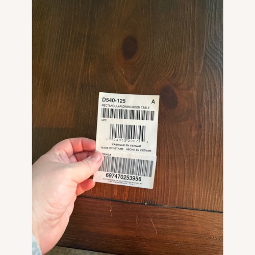 Used Ashley Furniture Dark Brown Dining Table for sale on AptDeco