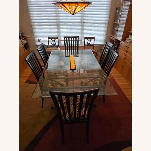 Used Bevel Edged Black Dining Set for sale on AptDeco