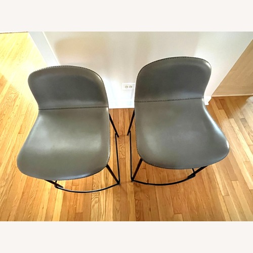 Used CB2 Light Gray Leather Dining Chairs for sale on AptDeco