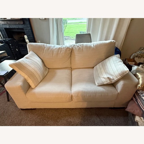 Used Ashley Furniture Maggie White Loveseat for sale on AptDeco
