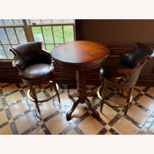 Used  2 Swivel Leather Bar Stools and Table for sale on AptDeco