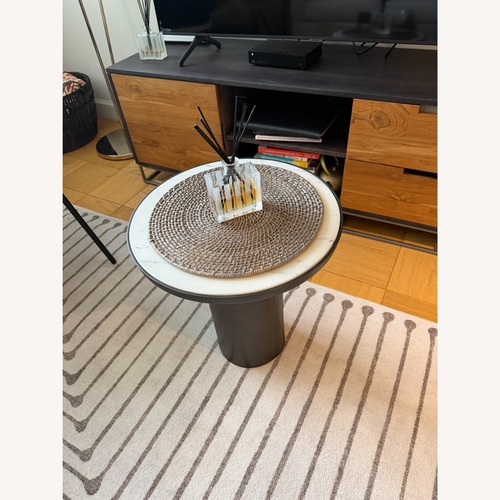 Used CB2 Discuss Natural Round Marble Side Table for sale on AptDeco