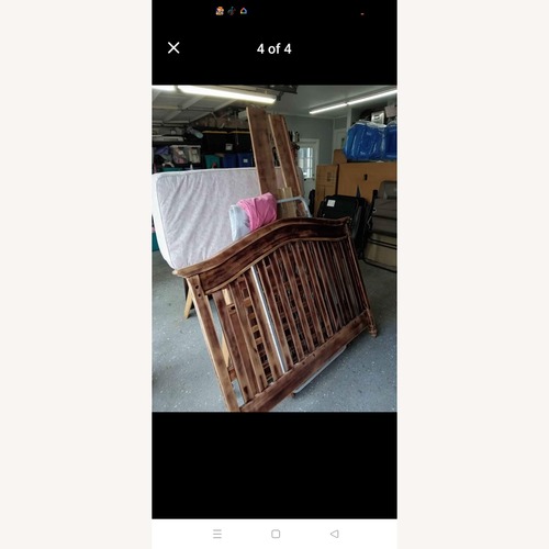 Used Light Brown Wood Crib for sale on AptDeco