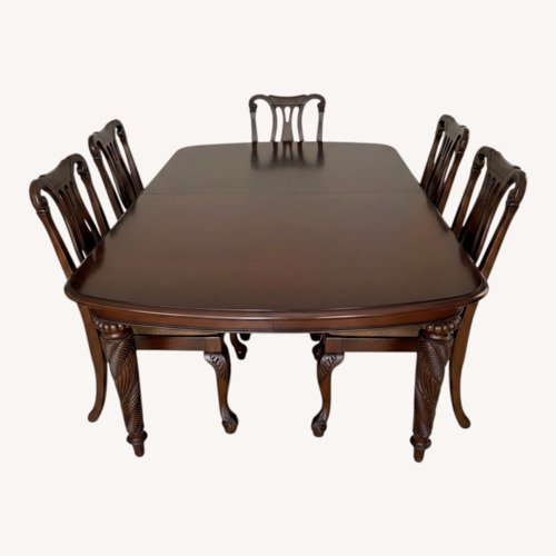 Used Dark Brown Wood Dining Set for sale on AptDeco