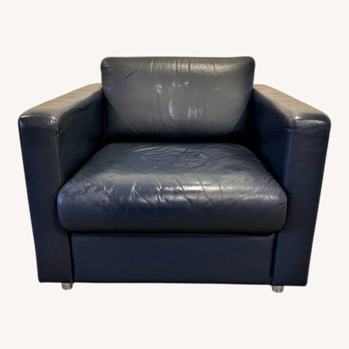 Used Mid-Century Blue Leather Club Chair on Casters for sale on AptDeco