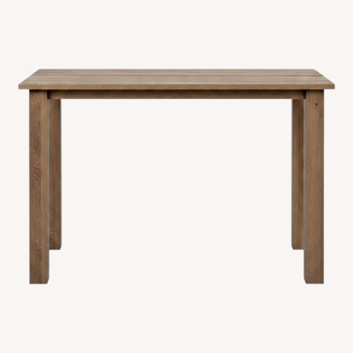 Used Amazon Light Brown Wood Dining Table for sale on AptDeco