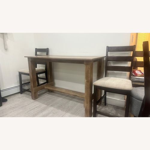 Used Amazon Light Brown Wood Dining Table for sale on AptDeco