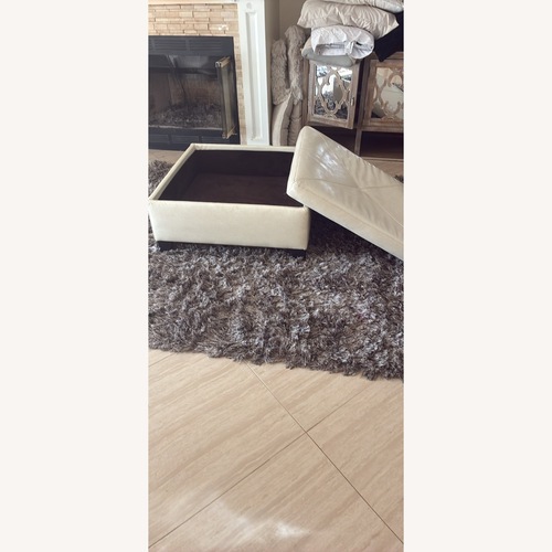 Used Cream Colored Storage Ottoman Faux Leather for sale on AptDeco