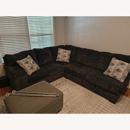 Used Ashley Furniture Black Hollyview Shadow Sectional for sale on AptDeco
